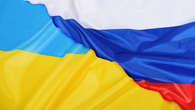 Background of Ukraine country flag versus Russia flag