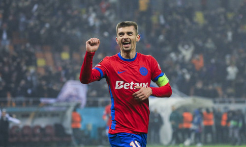 10 Florin Tanase celebrates scoring his first goal of the matchand winning the match