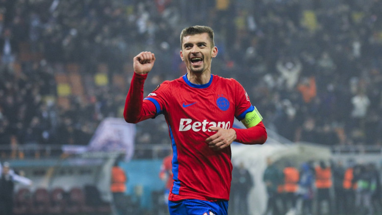 10 Florin Tanase celebrates scoring his first goal of the matchand winning the match