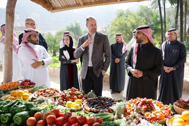 Abdullah Alhumaid, Prince William, Prince of Wales and Prince Badr bin Abdullah bin Farhan Al Saud view products as they meet farmers during a visit to AlUla's Oasis and Eco-Gardening Farm, to learn about their commitment to sustainable farming on day thr
