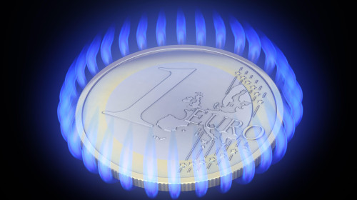 Euro coin surrounded by gas flames - gas prices are rising