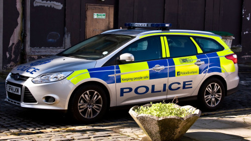 "Police Scotland" “Police Car parked along an old narrow cobbled side street at the back of "Forum" shopping Mall in Dundee, UK