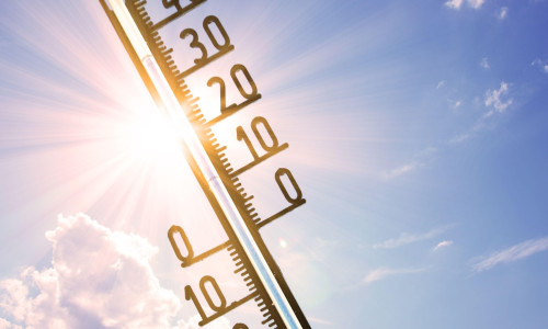 Mercury thermometer. Summer heat or global warming climate change concept.