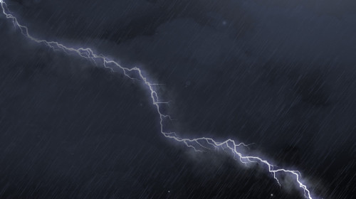 Image of thunderstorm with lightning, heavy rain and grey clouds