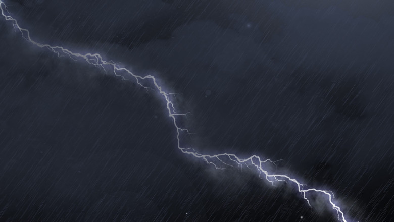 Image of thunderstorm with lightning, heavy rain and grey clouds