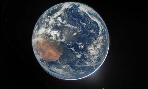 A high resolution view of Earth taken by NASA astronaut and Artemis II Commander Reid Wiseman from of the Orion spacecraft's window after completing the translunar injection burn on April 2, 2026. The image features two auroras (top right and bottom left)