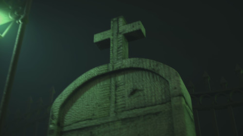 Image of graves on cemetery at night