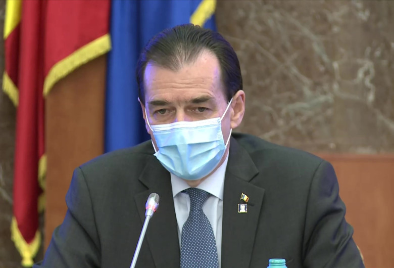 Ludovic Orban cu mască de protecție pe față