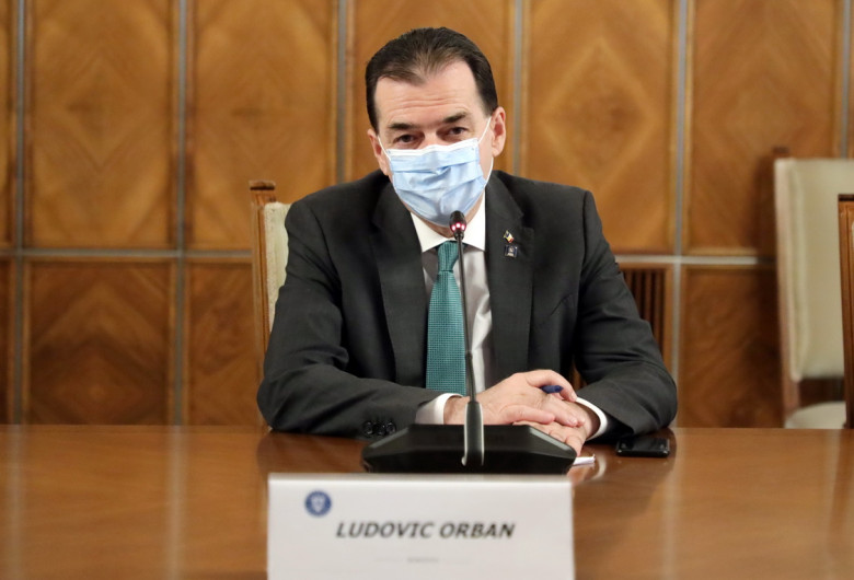 Ludovic Orban, la Guvern, cu mască de protecție
