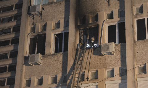 A firefighter inside the intensive care unit where a fire killed 10