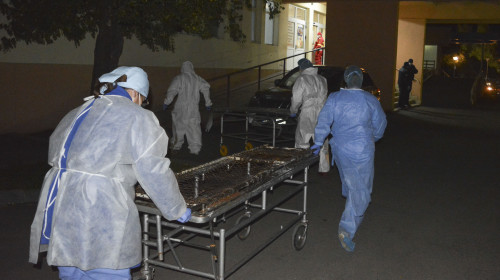 Medical staff rushes with stretchers to move the COVID-19 patients that where affected by a fire in the hospital in Piatra Neamt
