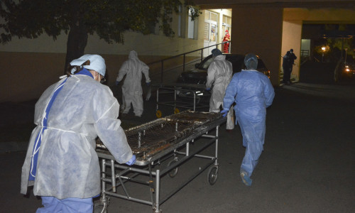 Medical staff rushes with stretchers to move the COVID-19 patients that where affected by a fire in the hospital in Piatra Neamt