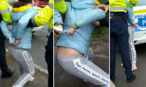 Femeie încătușată de polițiști