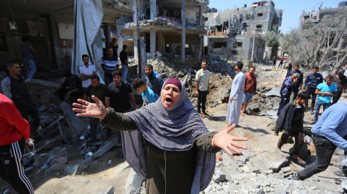 Palestinians inspect their homes that was destroyed by an Israeli airstrike, in Beit Hanoun in the northern Gaza Strip, Beit Hanoun, Gaza Strip, Palestinian Territory - 14 May 2021