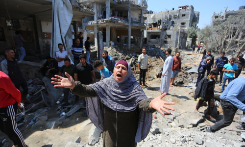 Palestinians inspect their homes that was destroyed by an Israeli airstrike, in Beit Hanoun in the northern Gaza Strip, Beit Hanoun, Gaza Strip, Palestinian Territory - 14 May 2021