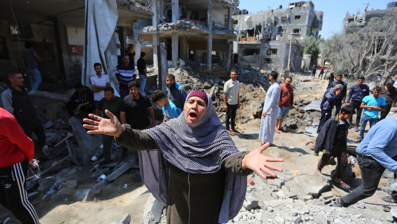 Palestinians inspect their homes that was destroyed by an Israeli airstrike, in Beit Hanoun in the northern Gaza Strip, Beit Hanoun, Gaza Strip, Palestinian Territory - 14 May 2021