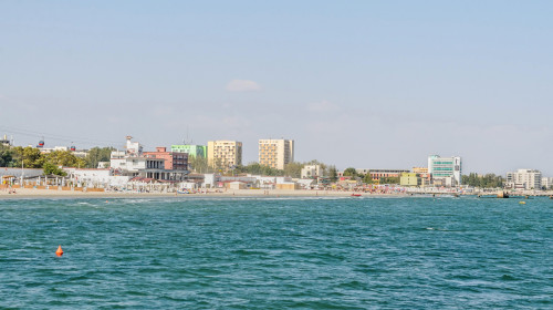 CONSTANTA, ROMANIA - SEPTEMBER 16, 2016: The Black Sea, seafront and seaside with blue water and gold sand, hotels.
