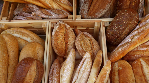 Fresh bread loaves and baguettes on retail display