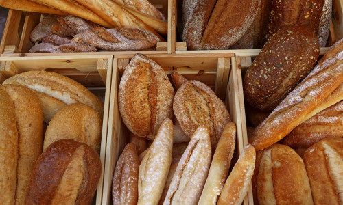 Fresh bread loaves and baguettes on retail display