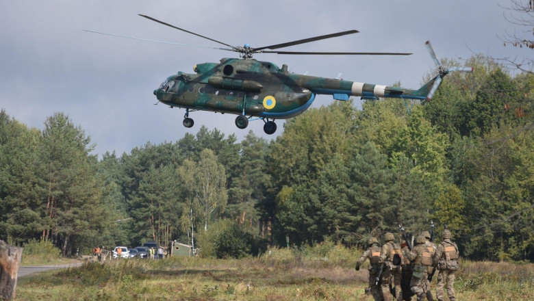 Ukrainian soldiers and ukrainian helicopter during a joint military exercise Rapid Trident 2019 at a at the International Center for Peacekeeping and Security of the National Academy of Land Forces near Lviv.
