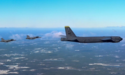 A B-52H Stratofortress from the 69th Expeditionary Bomb Squadron at RAF Fairford, England is escorted by two Swedish Saab JAS 39 Gripens, Feb. 18, 2022. The Swedish fighters met with the B-52 during a sortie over Sweden to practice establishing communicat