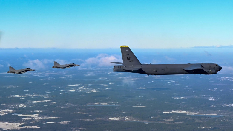 A B-52H Stratofortress from the 69th Expeditionary Bomb Squadron at RAF Fairford, England is escorted by two Swedish Saab JAS 39 Gripens, Feb. 18, 2022. The Swedish fighters met with the B-52 during a sortie over Sweden to practice establishing communicat