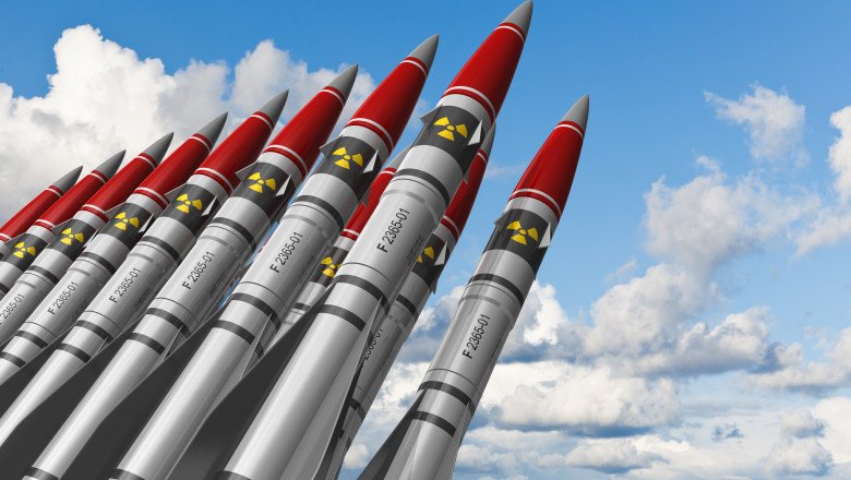 Row,Of,Heavy,Nuclear,Missiles,Against,Blue,Sky,With,Clouds