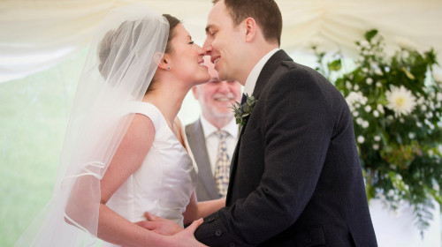 Newlywed couple kissing in wedding