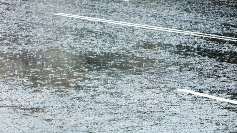 city road flooded with water during heavy rain