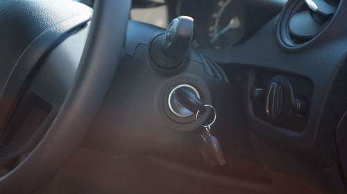 Car interior with steering wheel and key