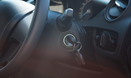 Car interior with steering wheel and key