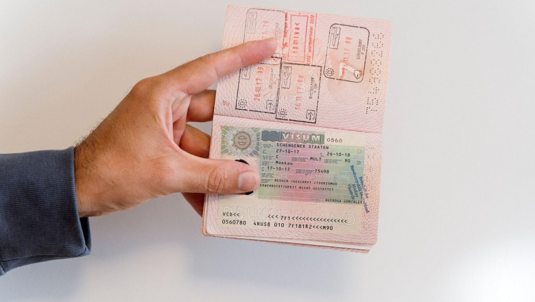 Russian passport in the hands of a man. Prohibition of Schengen visas for Russian tourists to travel to the European Union concept. High quality photo