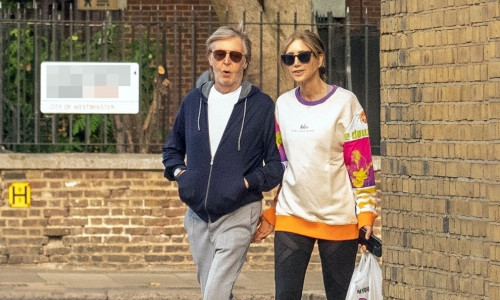 *EXCLUSIVE* *STRICTLY NO WEB USE UNTIL 22:00 HRS UK TIME ON 15/10/22*Romance is in the air as Sir Paul McCartney and his colourfully dressed wife Nancy Shevell walk arm-in-arm through the leaves on a sunny day in London.