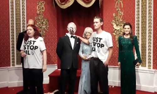 Eco protesters throw cake at King Charles waxwork