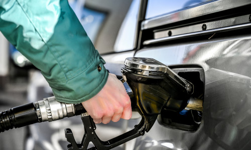 Woman,Refueling,At,A,Gas,Station.,Pumping,Gas.