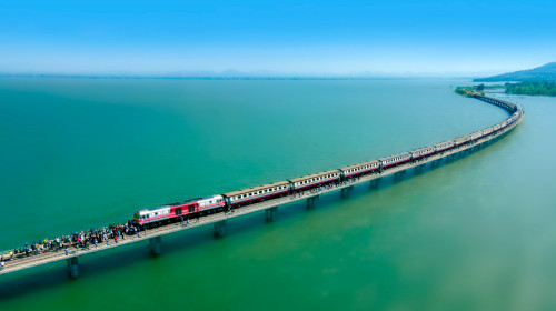 Aerial,View,Of,Travel,Train,Parked,On,A,Floating,Railway