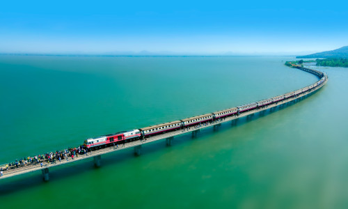 Aerial,View,Of,Travel,Train,Parked,On,A,Floating,Railway
