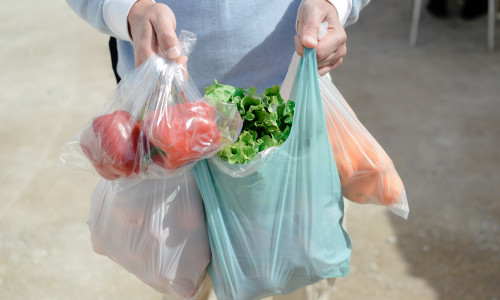 Close,Up,On,Person,Buyer,Hold,Groceries,In,Bags.,Buy