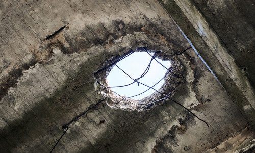 Vintage,Abandoned,Damaged,House,Roof,With,Hole,In,Ceiling,Overlooking