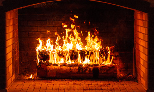 Glowing,Fire,In,A,Huge,Stone,Fireplace