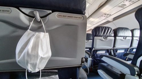 Protective,Medical,White,Safety,Mask,Hanging,In,Airplane,For,Covid-19,
