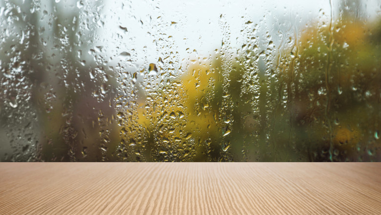 Wooden,Table,Near,Window,On,Rainy,Day