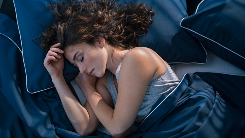 Top,View,Of,Young,Woman,Sleeping,On,Side,In,Her