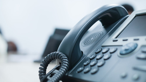 Close,Up,Soft,Focus,On,Telephone,Devices,At,Office,Desk