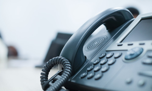 Close,Up,Soft,Focus,On,Telephone,Devices,At,Office,Desk