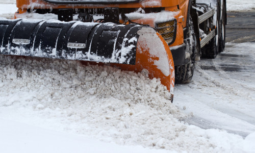 Front,View,Of,An,Orange,Snow,Plug,Working,On,A