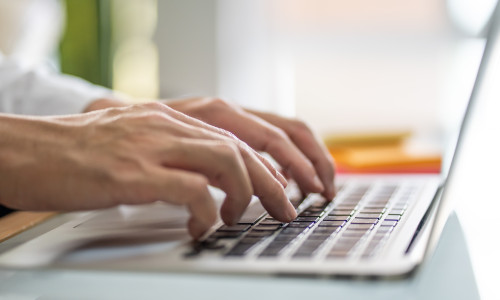 Men,Hand,Typing,On,Computer,Keyboard,While,Working,From,Home