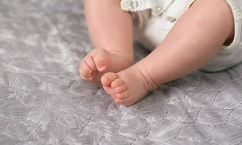 Adoption,Of,The,Newborn.,Legs,Baby,Closeup.,Lonely,Little,Abandoned