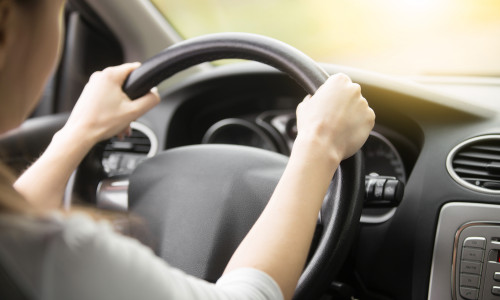 Close,Up,Of,Female,Hands,On,The,Steering.,Traveler,Girl