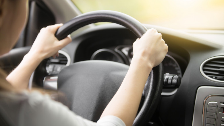Close,Up,Of,Female,Hands,On,The,Steering.,Traveler,Girl